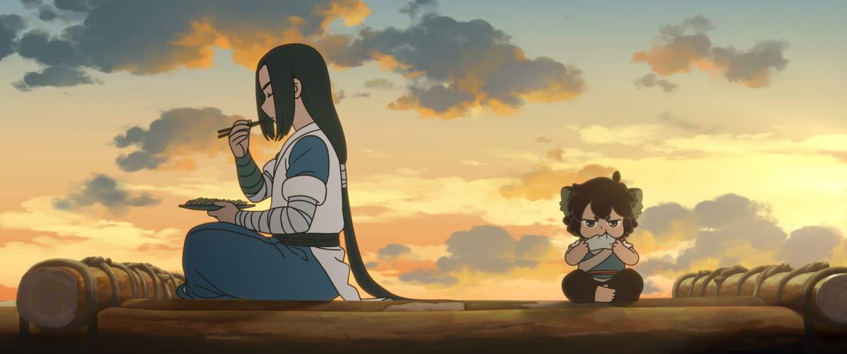 (L-R) A long-haired animated character (Wuxian) and a short-haired animated boy with cat ears (Luo Xiaohei) sit on opposite ends of a wooden raft eating food in The Legend of Hei.