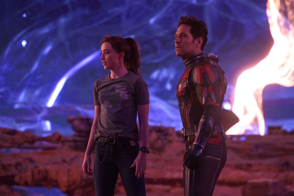 Paul Rudd in his Ant-Man suit stands next to Kathryn Newton in the Quantum Realm in Ant-Man and the Wasp: Quantumania.