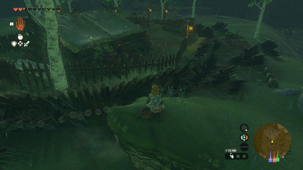 Link står på en liten klippa och förbereder sig för att hoppa över det spetsiga staketet i Zelda: Tears of the Kingdom