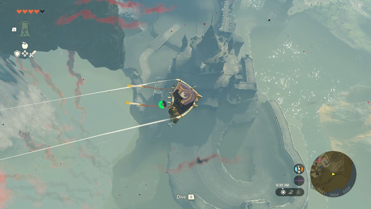 Link glider högt över Hyrule Castle i Zelda Tears of the Kingdom.