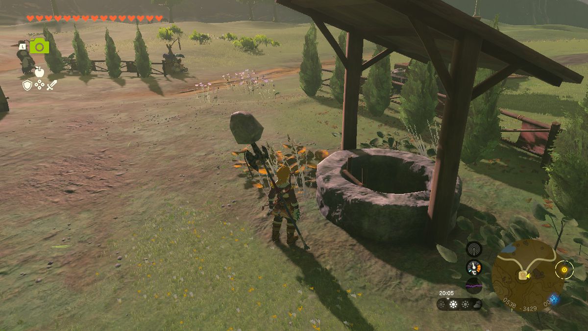 Link står bredvid en brunn vid Highland Stable i Zelda Tears of the Kingdom.