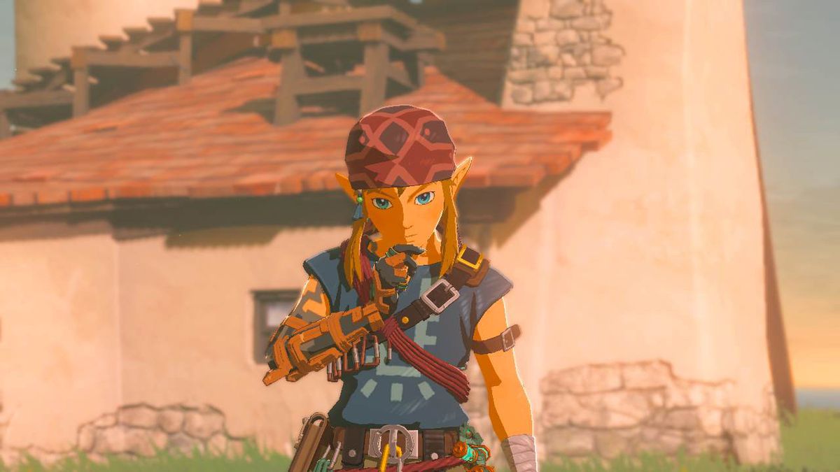 Link stands lost in thought in front of the camera while wearing the Climbing Armor set in Zelda: Tears of the Kingdom