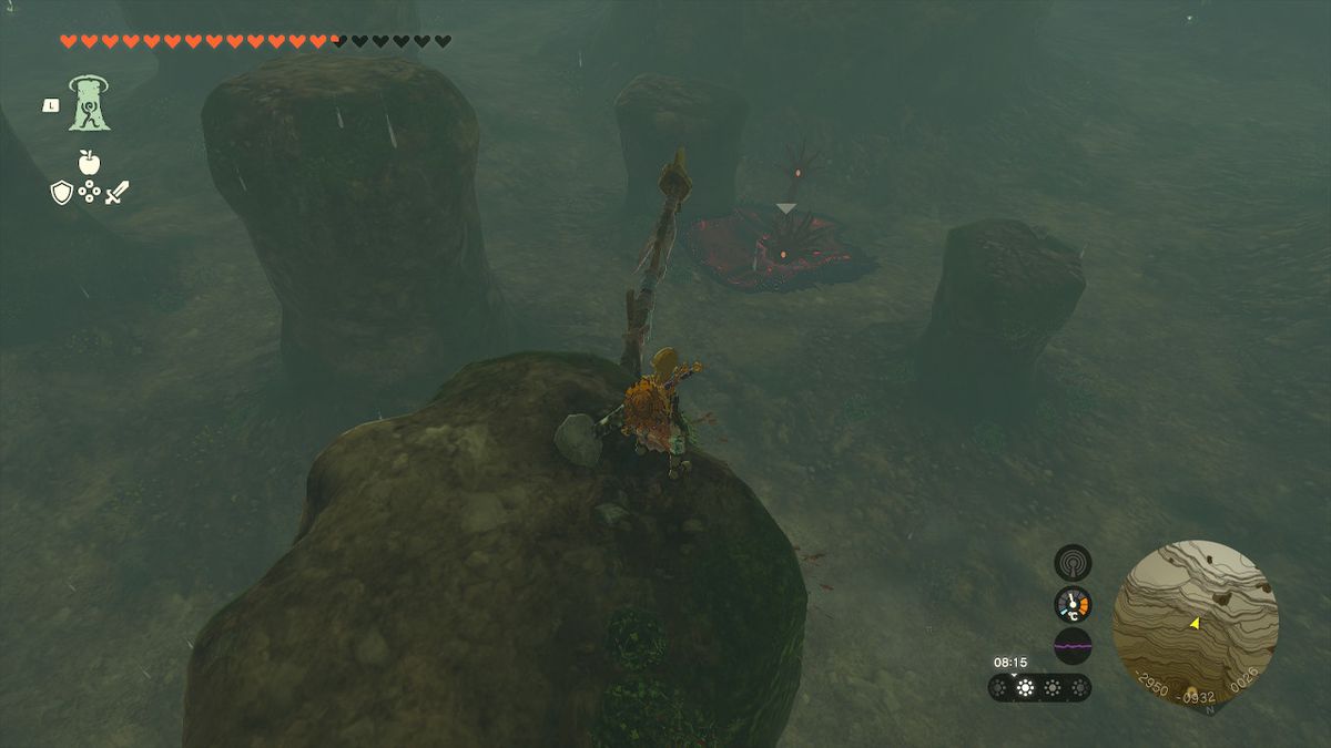 Link sitter på en avsats ovanför Gloom Hands i Tamio River Downstream Cave i Zelda Tears of the Kingdom.