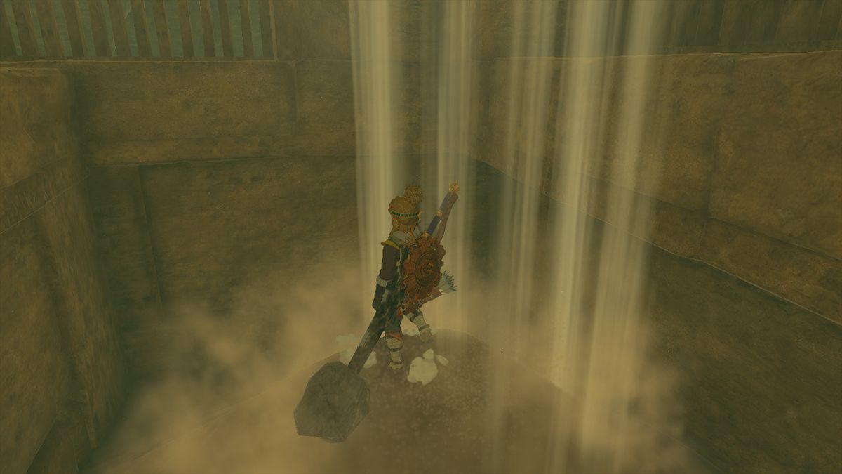 Link står på en pelare under ett sandfall i Zelda Tears of the Kingdom.