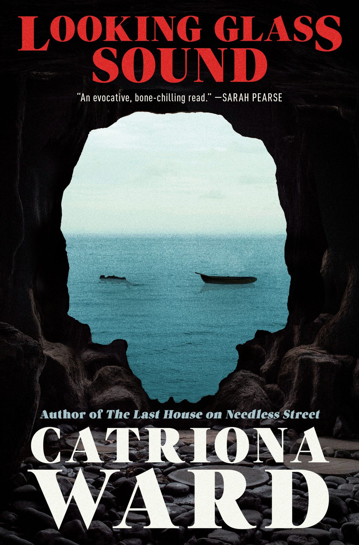 Cover image of Catriona Ward’s Looking Glass Sound. The image is from inside a cave, with a skull-shaped exit out into the ocean, where we see an empty boat and a person floating.