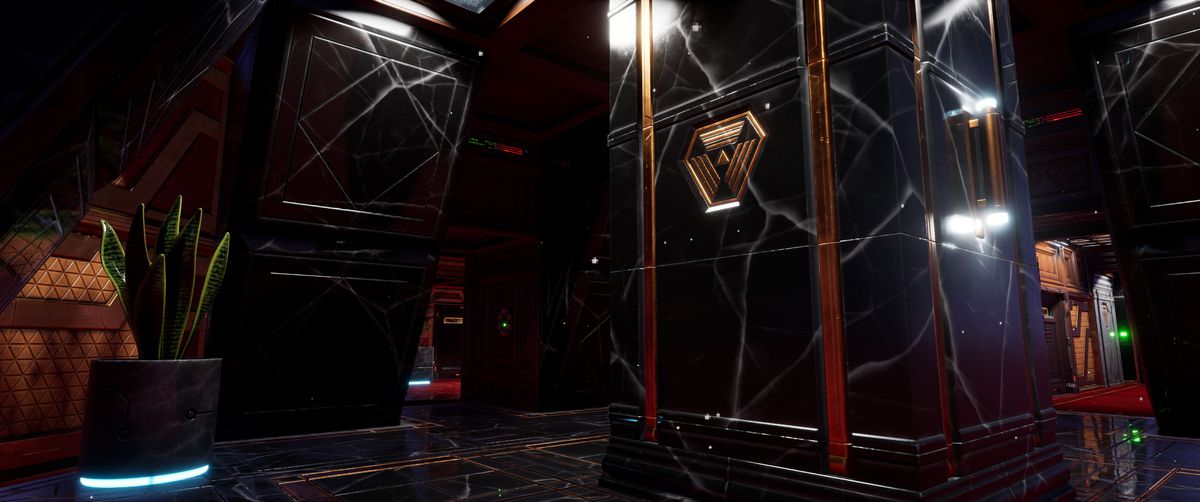 Ett lobbyliknande rum på rymdstationen System Shock-remaken, fyllt med marmorerade granitpelare och art déco-tillbehör
