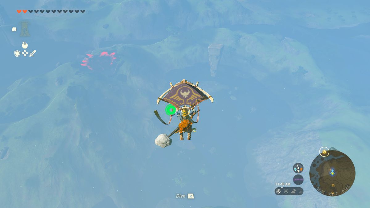 Link använder sitt glidflygplan för att sväva mot en stor sten