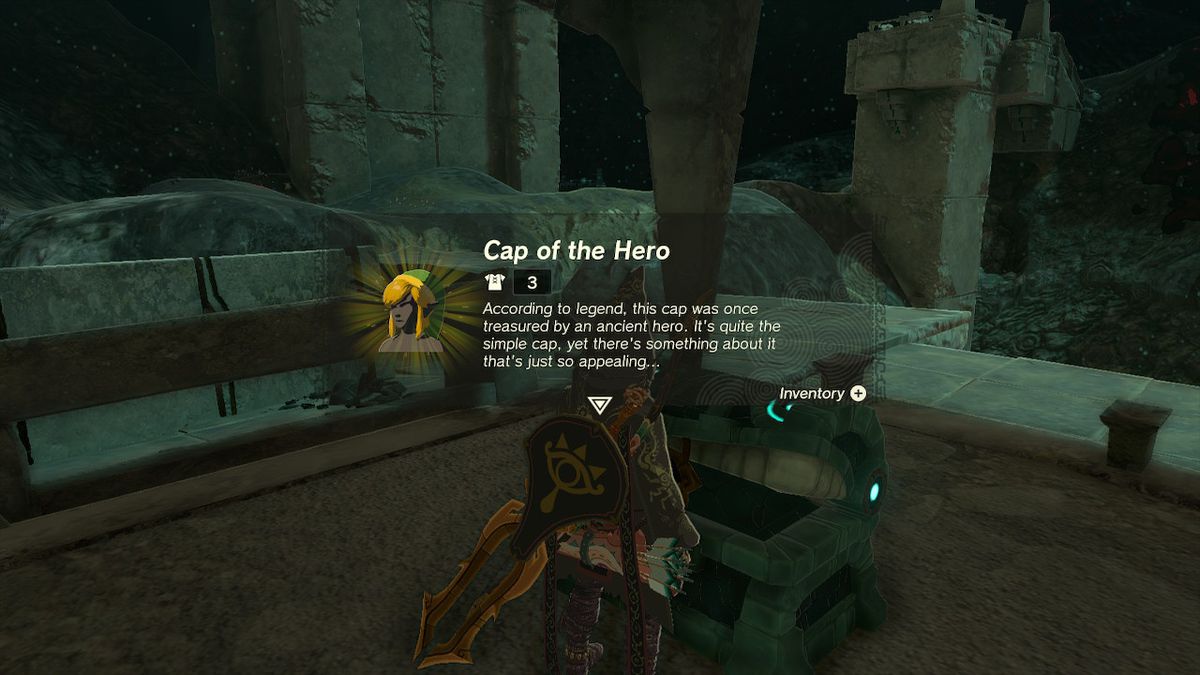 Link opens a chest containing the Cap of the Hero, the head piece for the Hero Armor, in the Depths in Zelda Tears of the Kingdom.