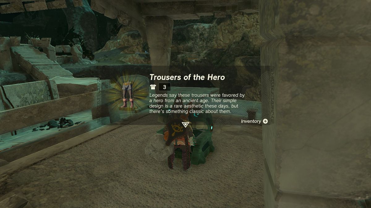 Link opens a chest containing the Trousers of the Hero, the legs of the Hero Armor, in the Depths in Zelda Tears of the Kingdom.