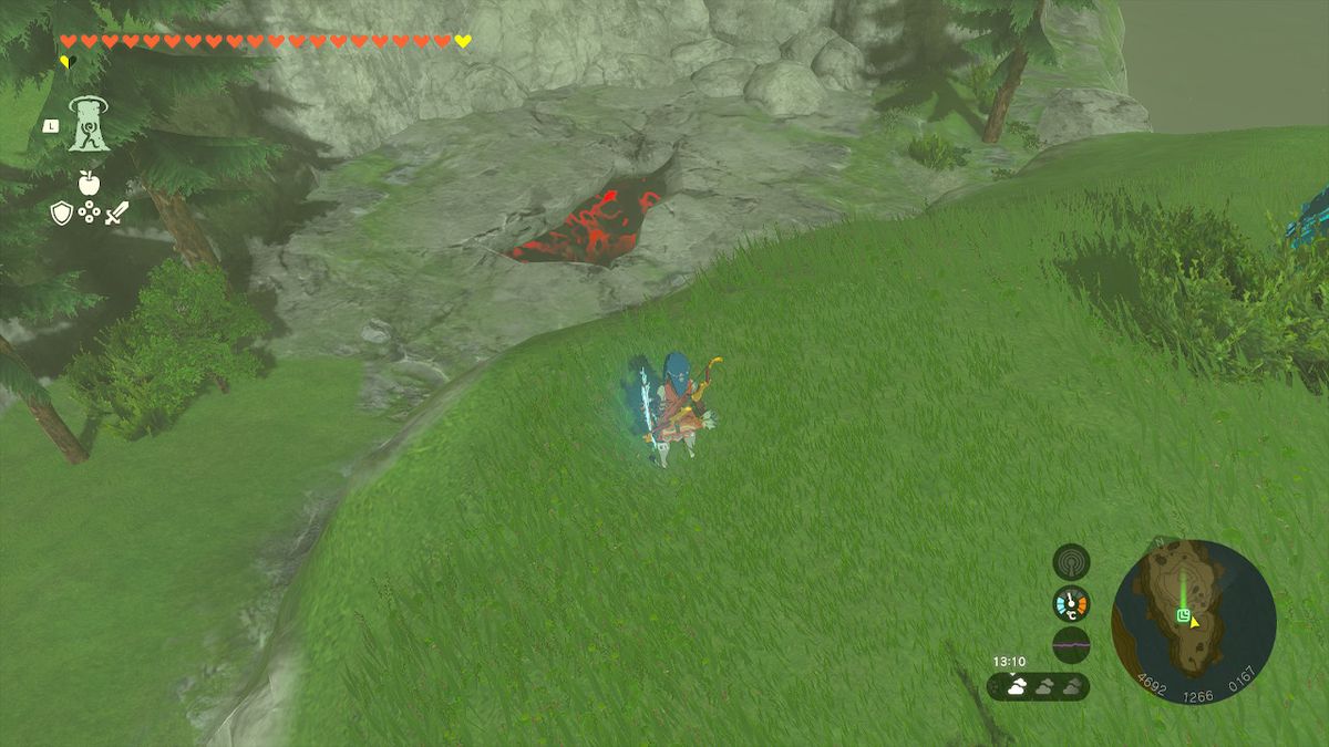 Link stands by a chasm in the ground in Hyrule while looking for the Wind Armor in Zelda Tears of the Kingdom.