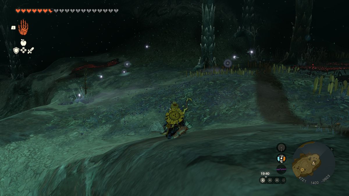 Link crouches while looking for fireflies in the Depths in Zelda Tears of the Kingdom.