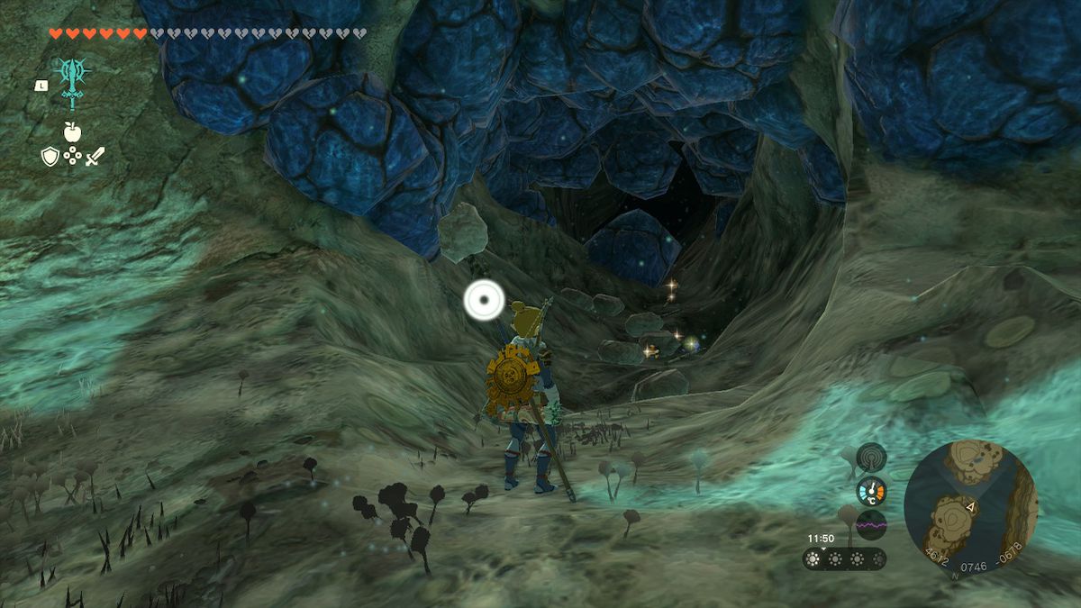 Link stands by a bunch of loot in the Depths in Zelda Tears of the Kingdom.