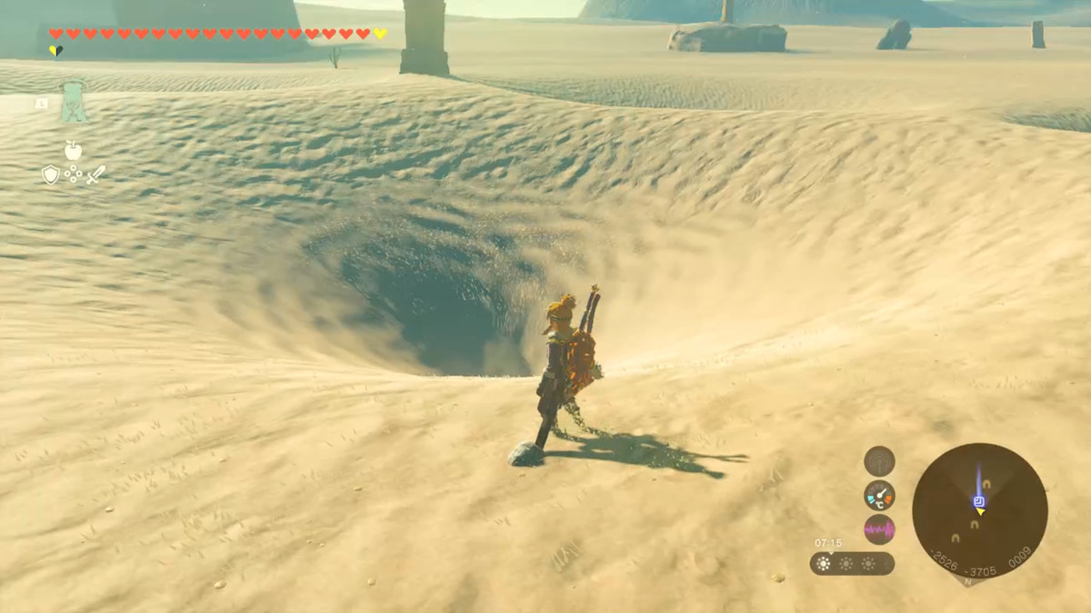 Link står vid en virvel i sanden i Zelda Tears of the Kingdom.
