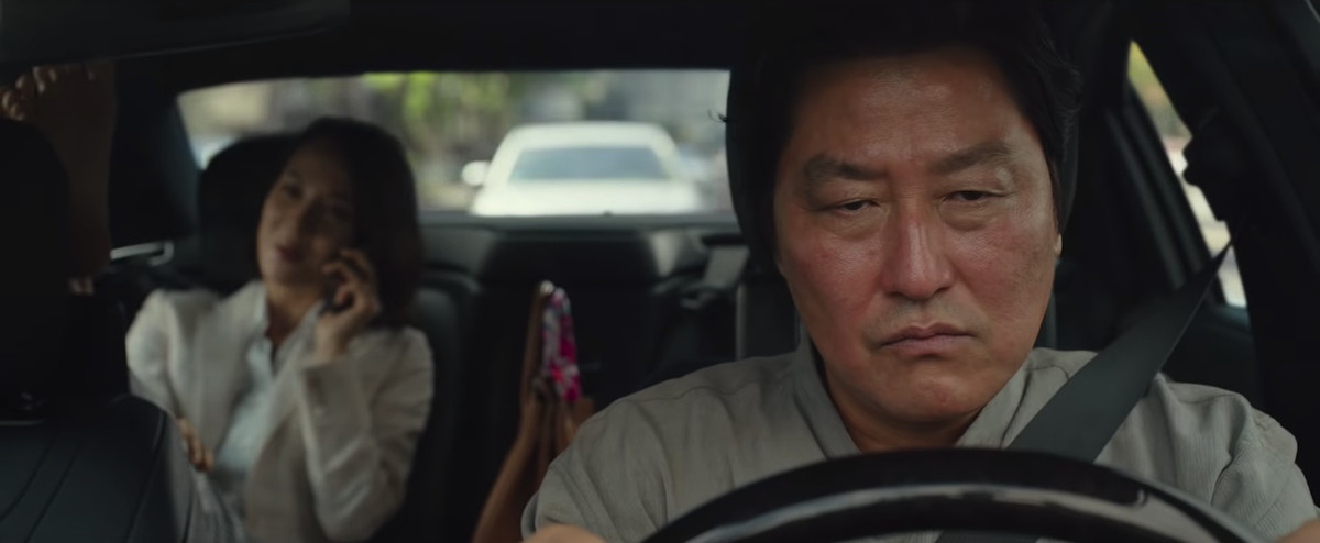 Mr. Kim (Song Kang-ho) drives a car but he’s pissed in Parasite