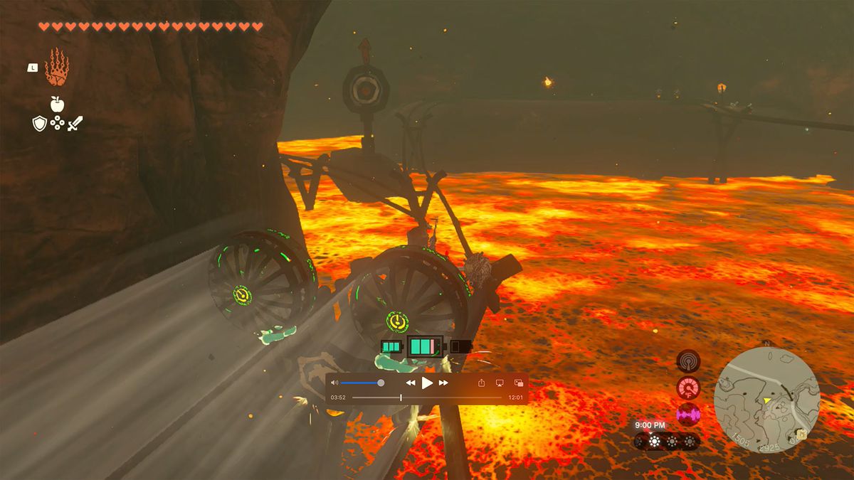 Link åker på en minkärra genom en lavafylld grotta i en skärmdump från The Legend of Zelda: Tears of the Kingdom