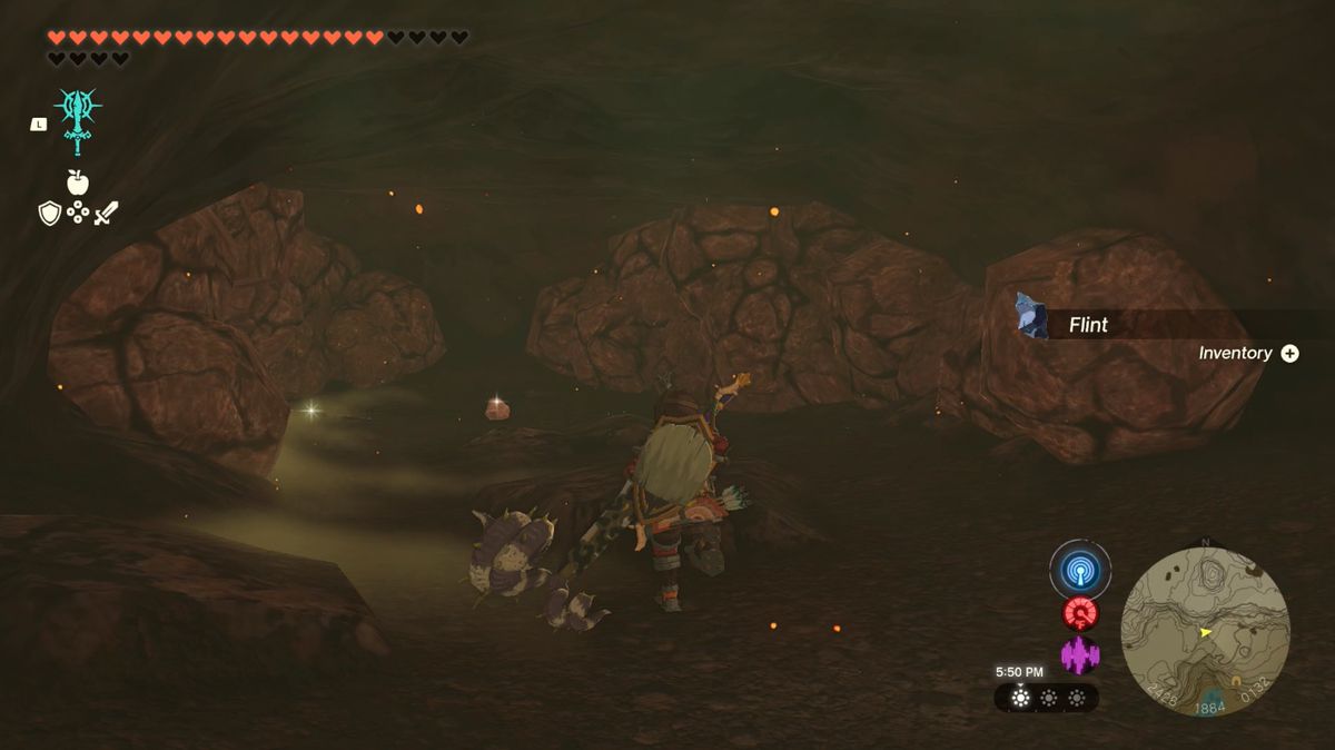 Link går mot några stenblock som blockerar en grottdörr i Lake Intenoch Cave mot Moshapin Shrine i Zelda: Tears of the Kingdom