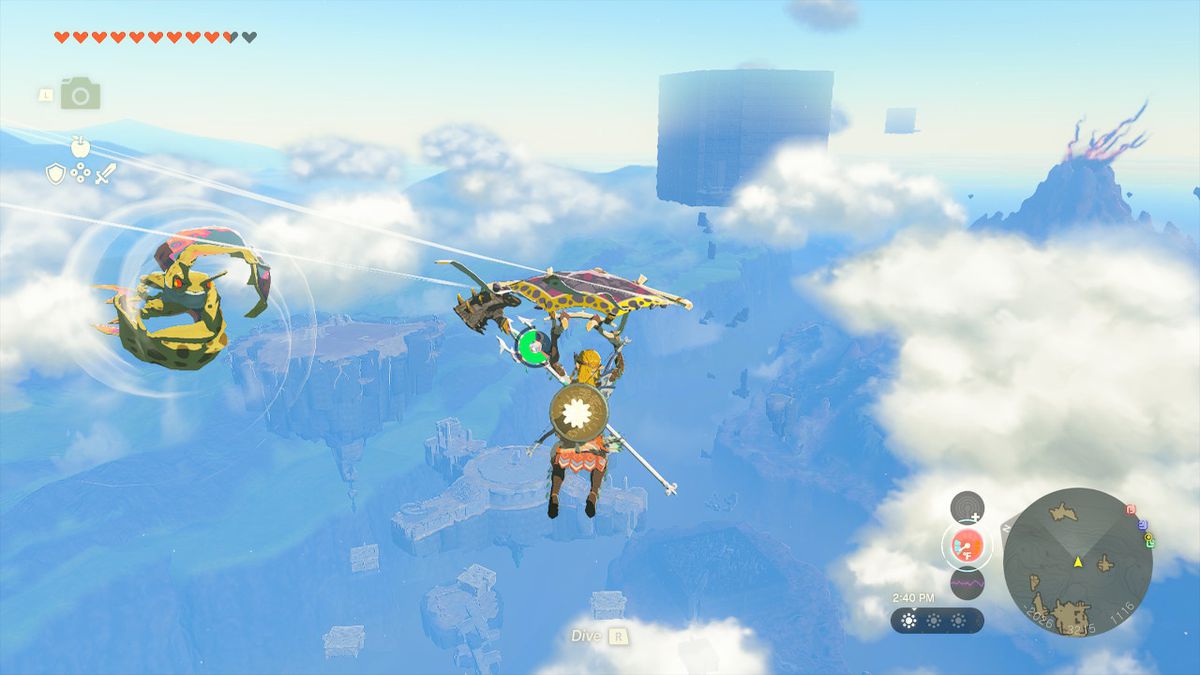 Link slowly descends with his paraglider as an Aerocuda prepares to attack him in mid-air in Zelda: Tears of the Kingdom