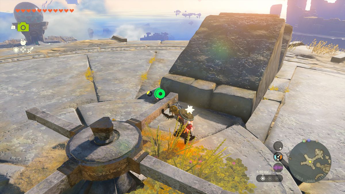Link pushes the lever at the center of the island to move the push mechanism in Zelda: Tears of the Kingdom