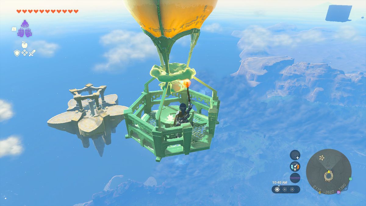 Link uses a lit torch to guide the air balloon closer to the star-shaped island in Zelda: Tears of the Kingdom