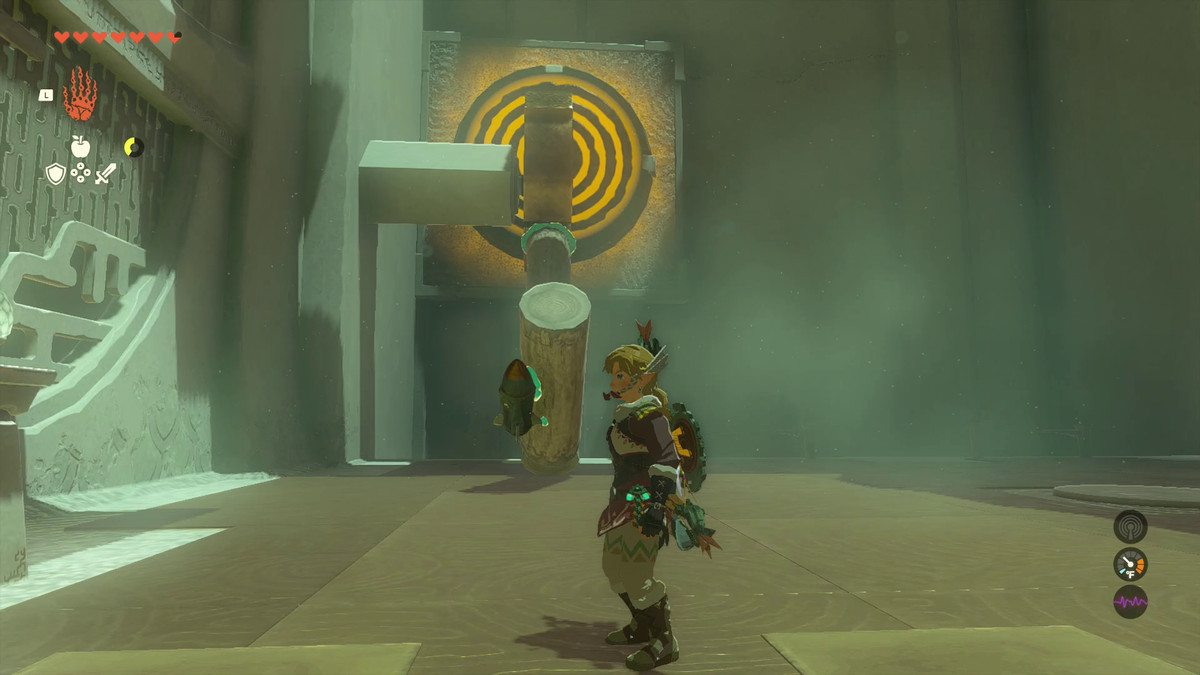 Link står tillbaka från sitt hantverk: Två trästockar med en raket på änden, fästa på en växel och redo att träffa ett gult mål i Oshozan-u Shrine