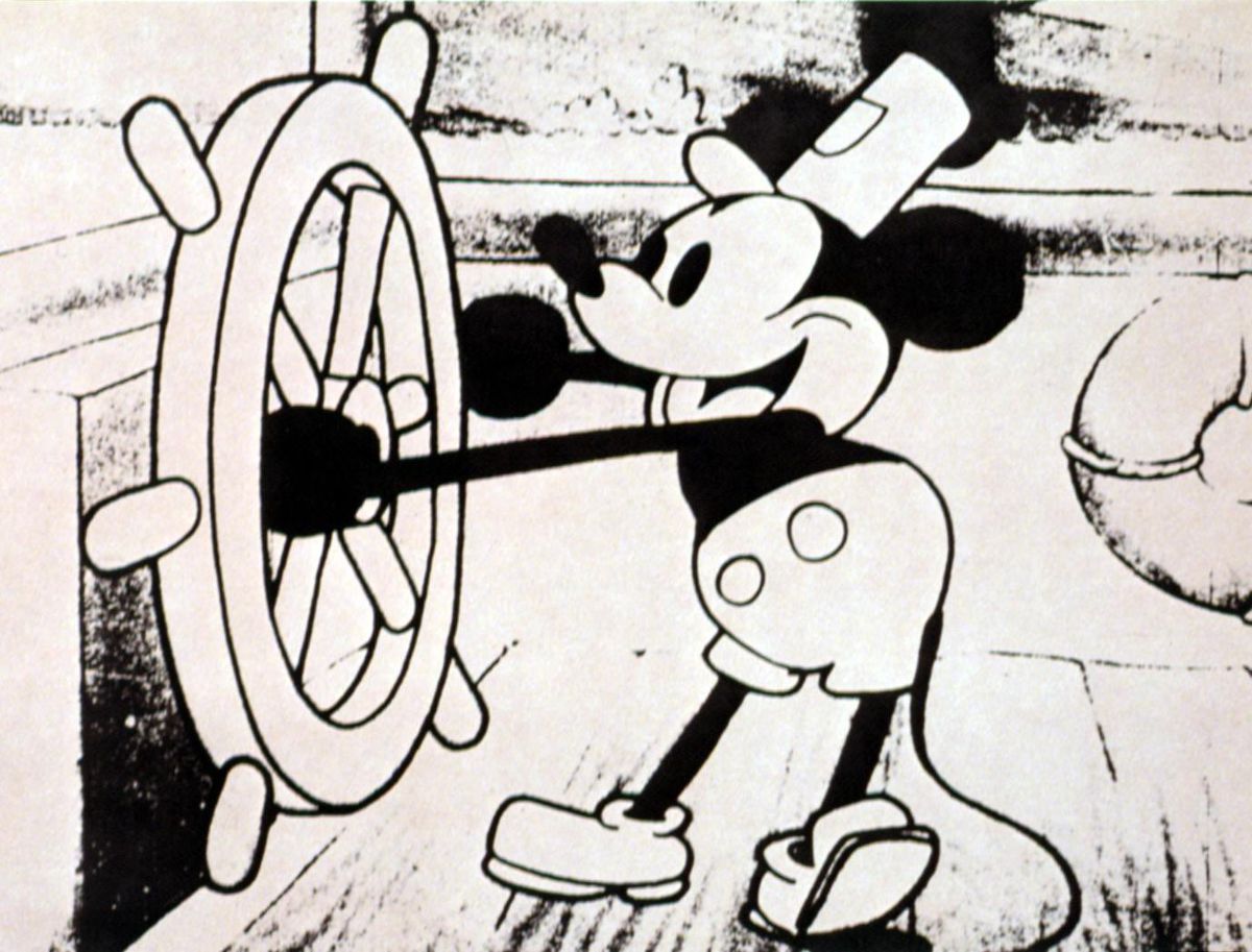 Detail from a lobby card for Disney’s 1928 animated short Steamboat Willie, with a line drawing of Mickey Mouse piloting a steamboat and wearing a captain’s cap