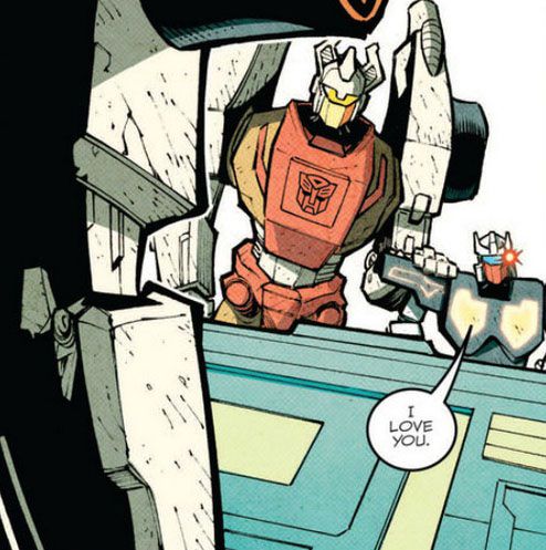 A simply drawn Robot tells another simply drawn robot “I love you,” in a panel from the More Than Meets The Eye comic