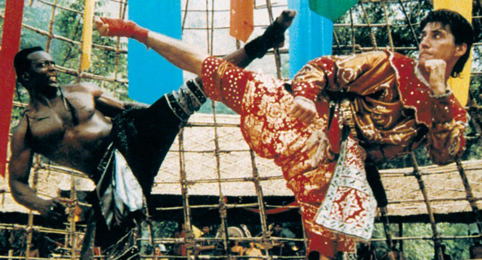 Billy Blanks and Loren Avedon match high kicks in The King of the Kickboxers.