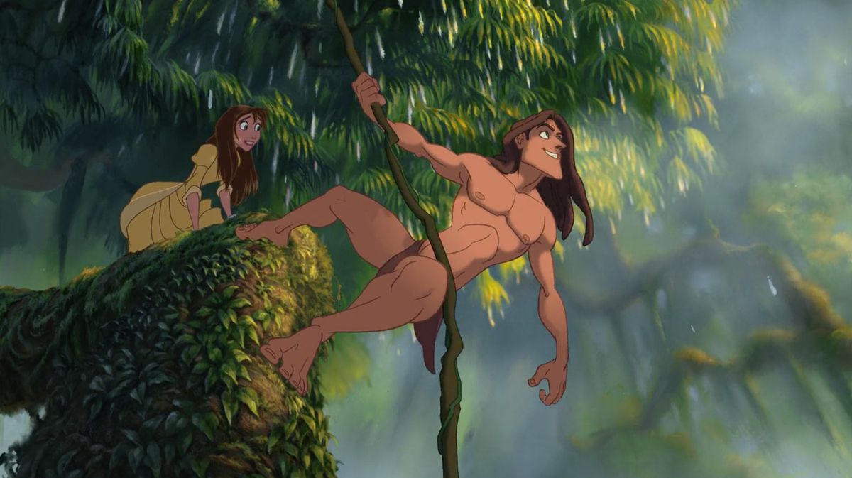 Disney’s Tarzan hangs from a vine, while Jane stands behind him gasping, in the 1999 Tarzan