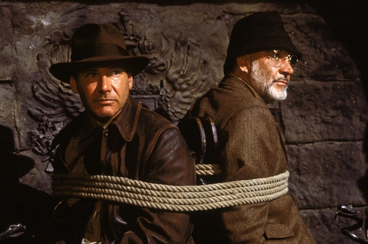 Indiana Jones (Harrison Ford) och Henry Jones (Sean Connery) är bundna till en stol