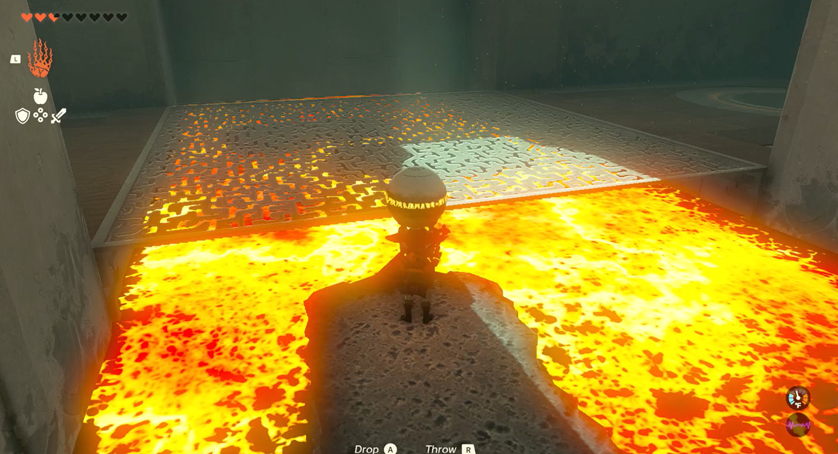 Link rider på en sten nerför en flod av eld och håller i en boll i The Legend of Zelda: Tears of the Kingdom's Timawak Shrine