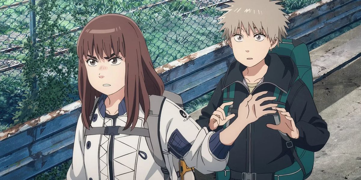 A brown-haired anime girl (Kiruko) in a white jacket stands in front of a gray-haired anime boy (Maru) in a black jacket in Heavenly Delusion.