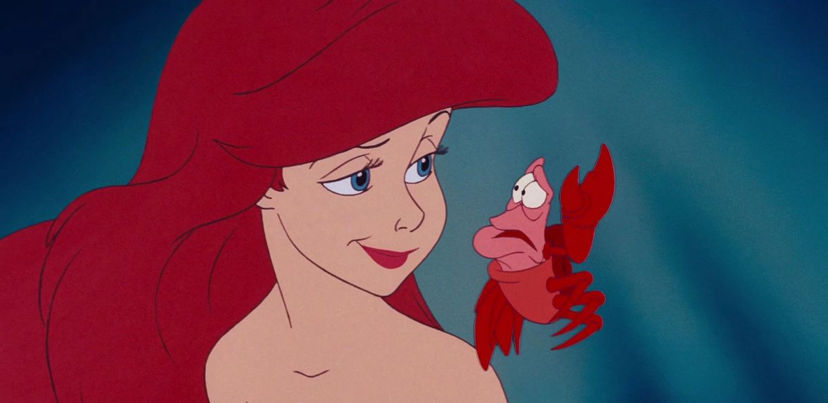 Ariel the mermaid smirks at a rather nervous-looking Sebastian the crab in Disney’s animated 1989 feature The Little Mermaid