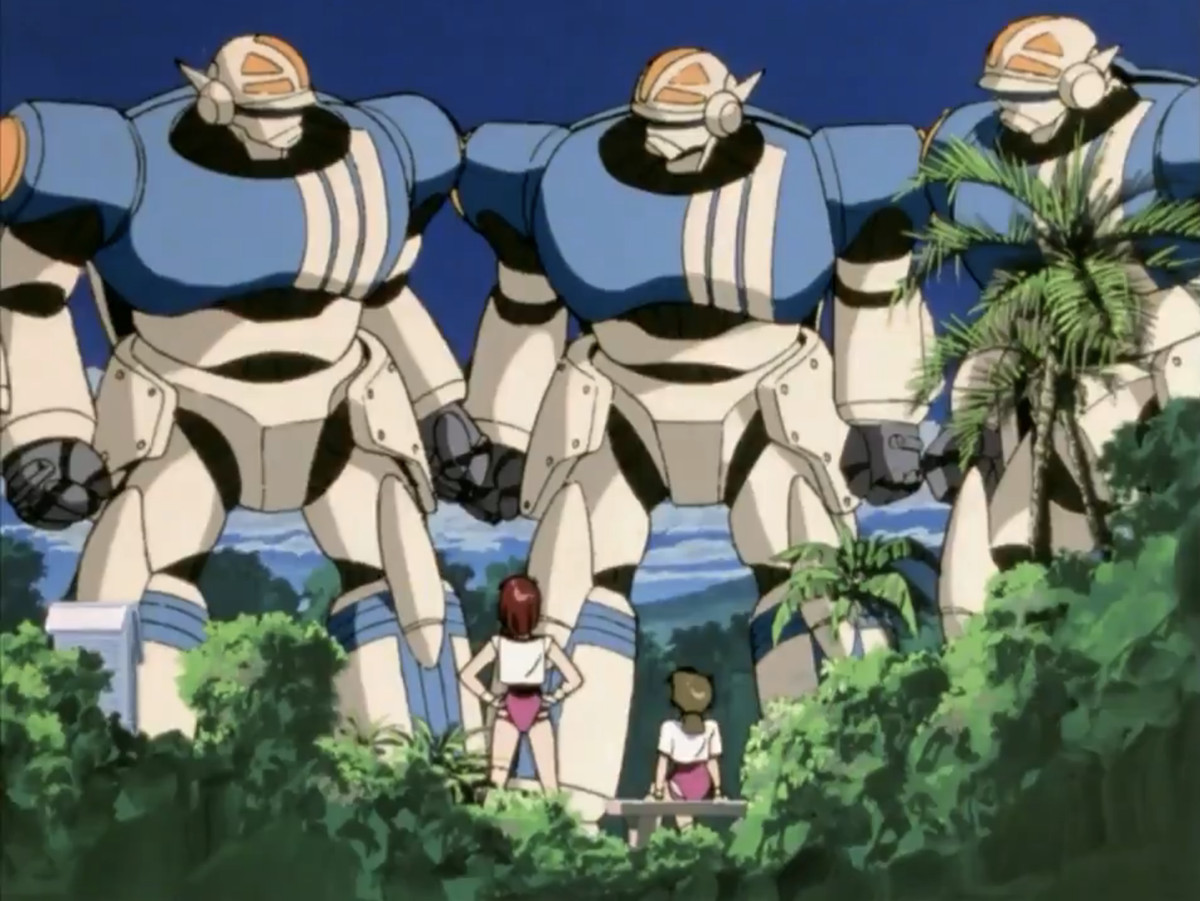 Noriko och hennes vän står i sina gymkläder och tittar upp på tre mechas i en skärmdump från Gunbuster