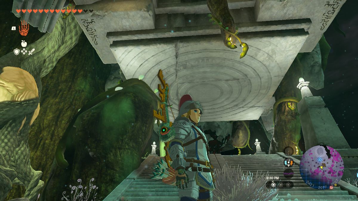 Länk som står framför en stenplattform i djupet i Zelda: TOTK