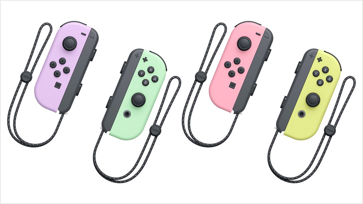 Fyra Nintendo Switch Joy-Cons med armband fästa i nya pastellfärger