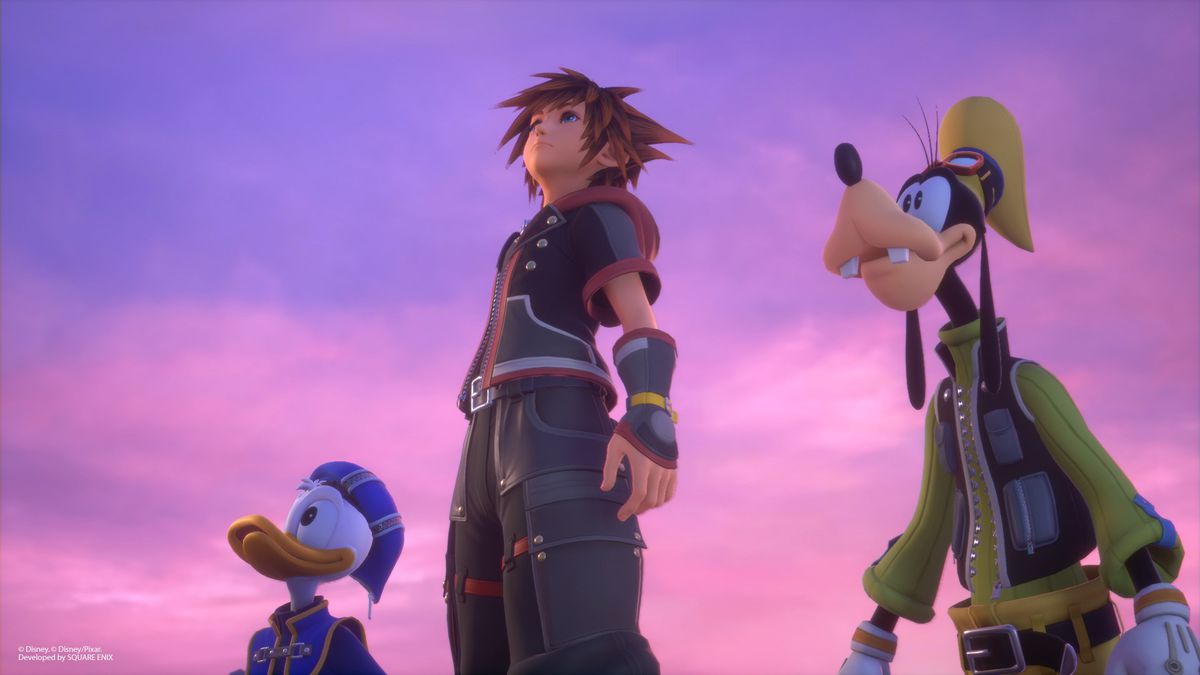 Donal Duck, Sora, and Goofy stand together, underneath a pinkish and purple sky. They are looking up and to the left.