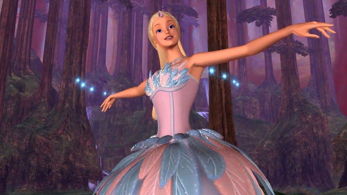 Barbie, a blonde girl, extending her arms as she gets a magical blue and pink feathered dress.