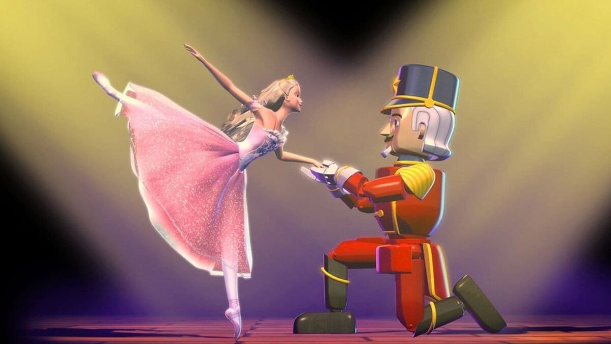 Barbie in a pink ballerina outfit, dancing with a Nutcracker.