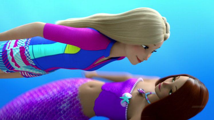 Barbie in a wet suit, swims above Isla, a purple-tailed mermaid. They look into each other’s eyes.