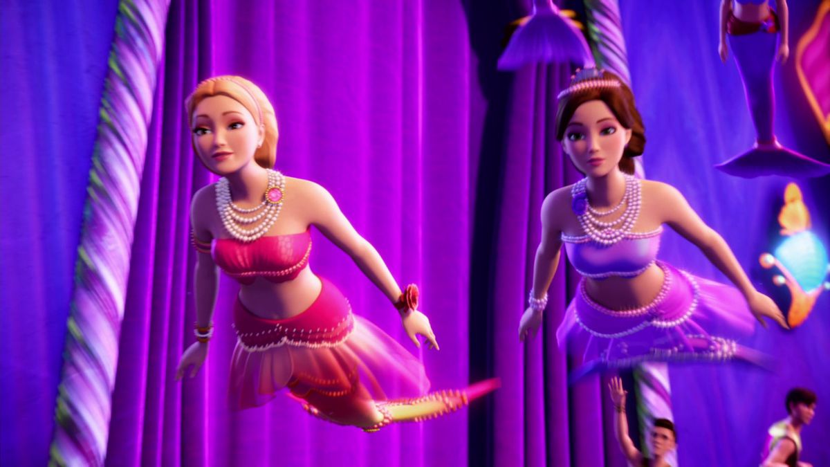 Barbie as a mermaid with a pink tail next to a brunette mermaid with a purple tail.