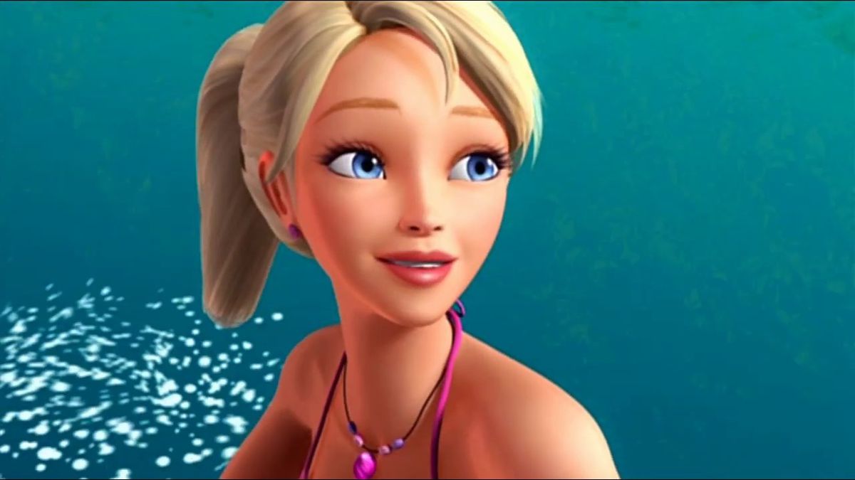 A closeup of Merliah, her blonde hair in a ponytail, as she surfs.