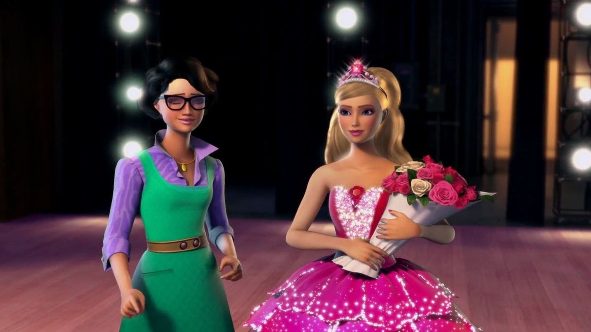 Barbie in a pink ballet outfit holding a bouquet, standing next to her costume designer friend.