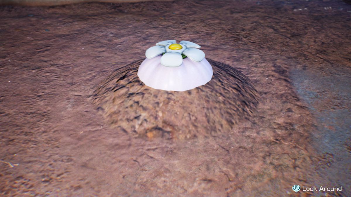 En vit lök i Pikmin 4 begravd i lite smuts i en grotta