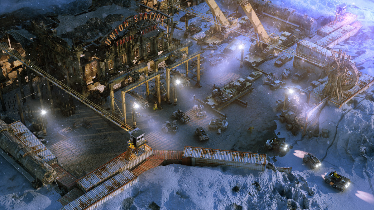 En isometrisk vy av en vintrig förening med lastbilar som lämnar den i videospelet Wasteland 3