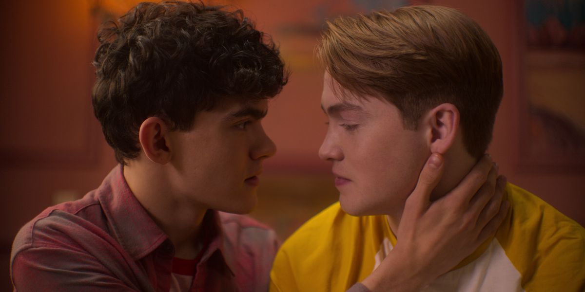 Charlie (Joe Locke) and Nick (Kit Connor) lean in for a kiss in a still from Heartstopper season 2