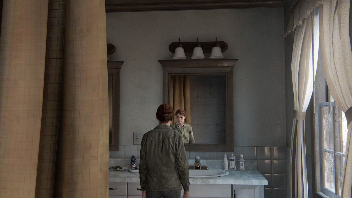 Ellie looks at herself in the mirror in The Last of Us Part 2