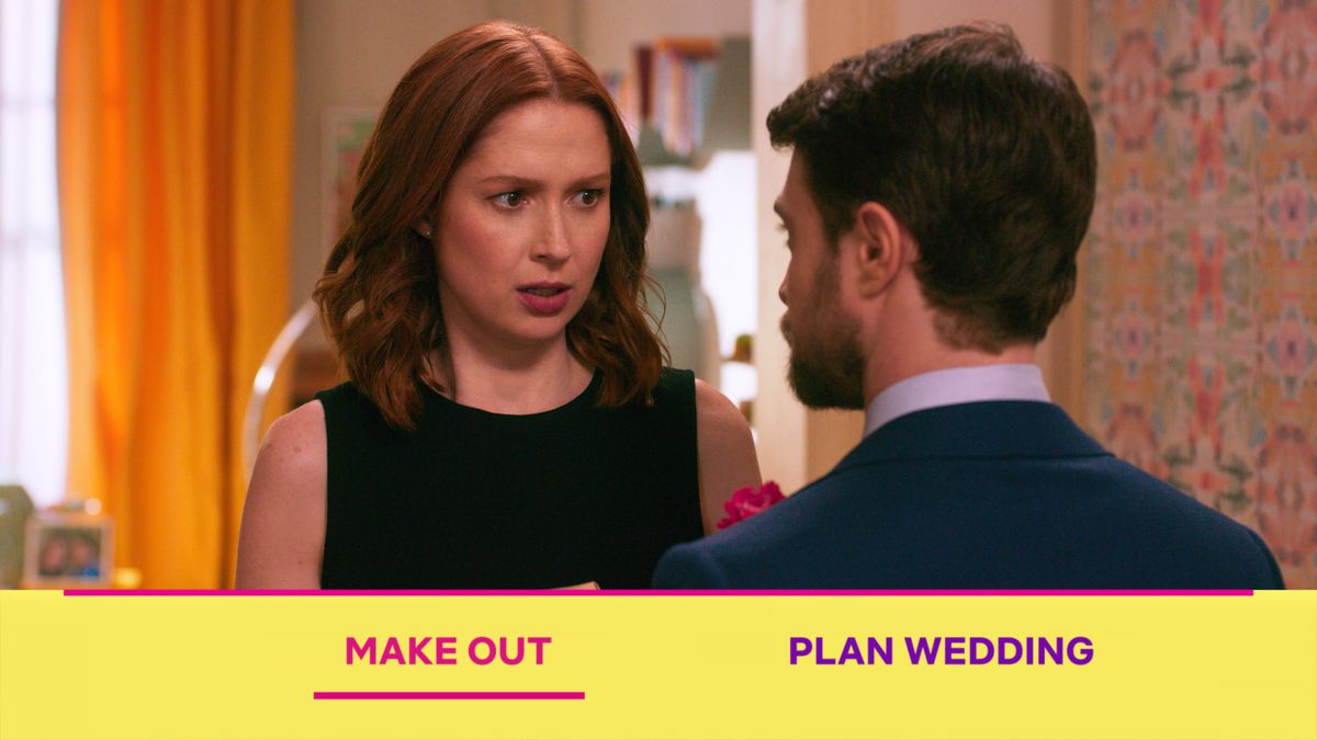 Ellie Kemper looks at Daniel Radcliffe in the Unbreakable Kimmy Schmidt interactive special, as the viewer is asked to choose between “Make out” and “Plan wedding.”