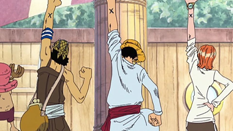 En bild av Luffy, Usopp och Nami som håller upp näven i animen One Piece. 