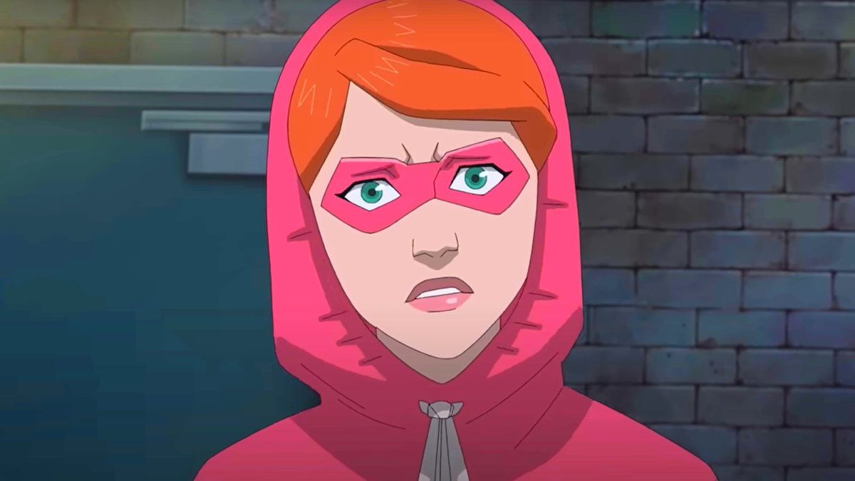 En ung Atom Eve, klädd i en rosa luvtröja och mask som täcker hennes ögon, ser förbryllad ut i Invincible: Atom Eve