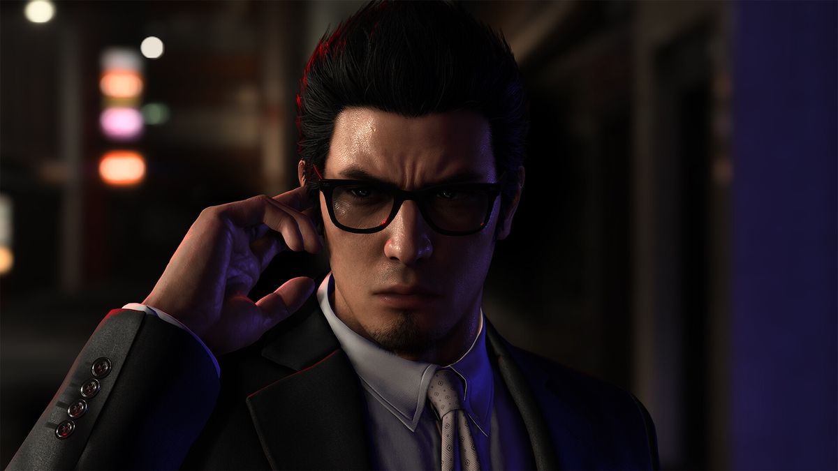 A yakuza wearing sunglasses holds his finger to hear something in an earpiece in Like a Dragon Gaiden: The Man Who Erased His Name 